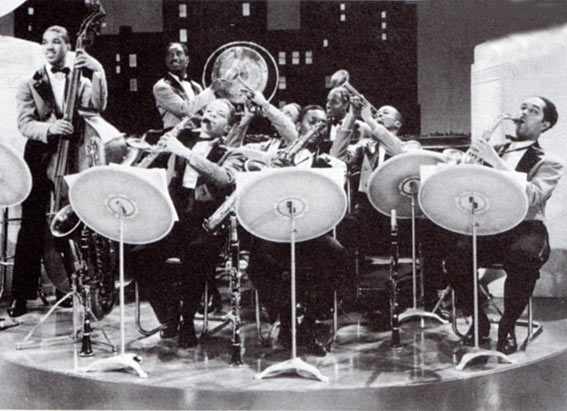 The Savoy Sultans, de g à d, Grachan Moncur II (b), Alex Razz Mitchell (dm), Rudy Williams (as, bar), Sidney Jenkins (tp), George Kelly (ts, cl), Cyril Haynes (p), Paul Chapman (g), Sam Massenberg (tp), Al Cooper (as, cl) © photo X The Savoy Sultans, de g à d, Grachan Moncur II (b), Alex Razz Mitchell (dm), Rudy Williams (as, bar), Sidney Jenkins (tp), George Kelly (ts, cl), Cyril Haynes (p), Paul Chapman (g), Sam Massenberg (tp), Al Cooper (as, cl) © photo X